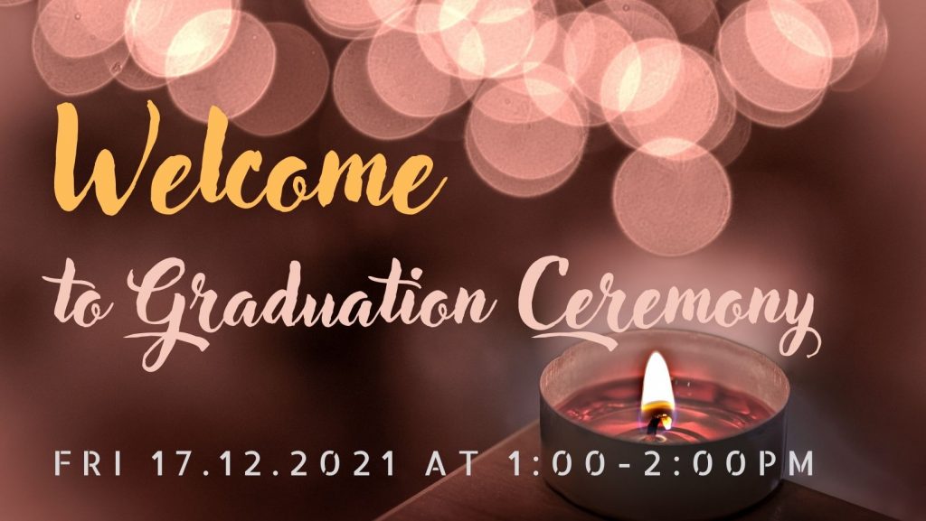 A red-coloured invitation for Humak's Graduation Ceremony in December. A tealight candle is placed on the right hand side corner.