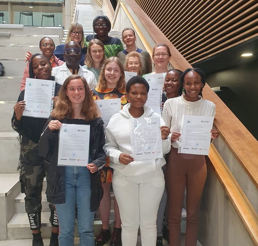 PEBES project team and students with their certificates in a group phot