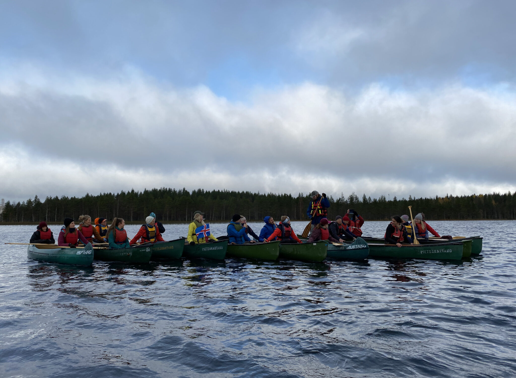 Picture 1.  Ten canoes together on water as a raft in Canoe workshop EOE Metsäkartano Finland. 