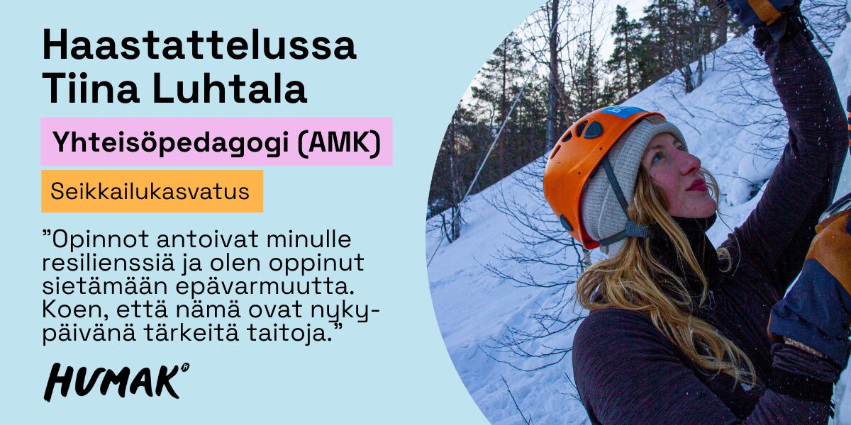 Humakin alumni kiipeää jääseinällä. Hänellä on päässä kirkkaan värinen kypärä.
