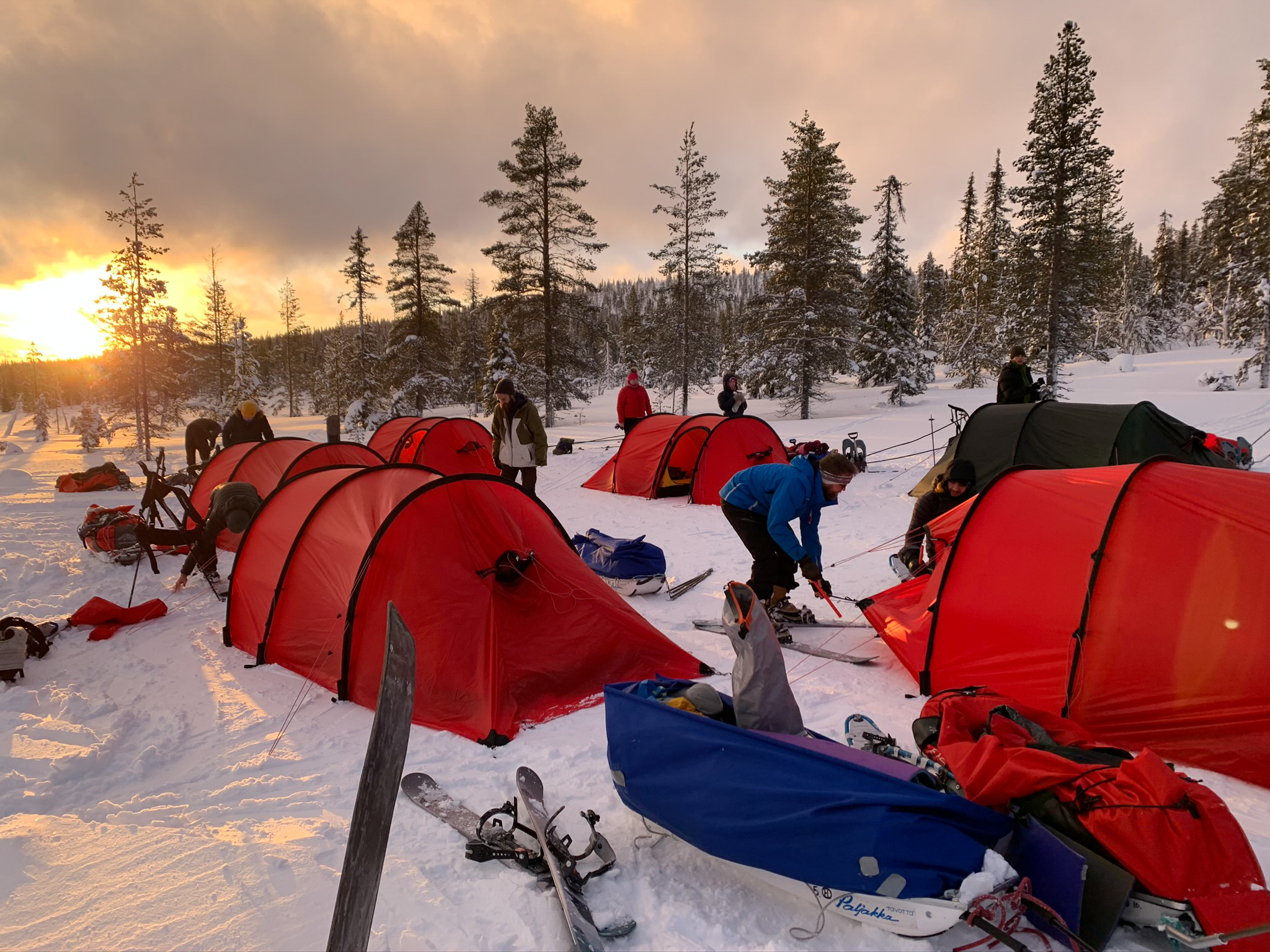 Adventure education students camp in a winter landscape 