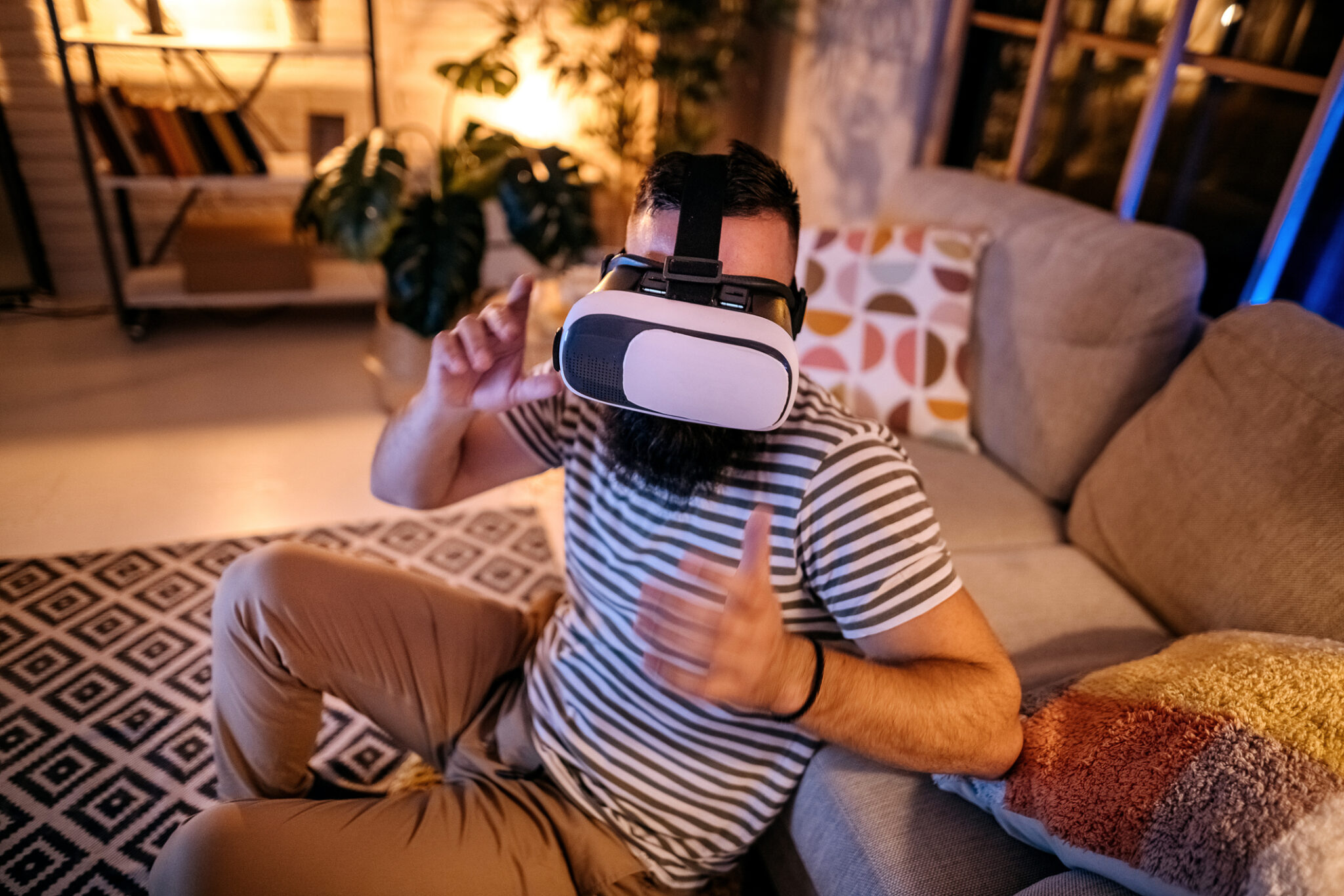 Surprised man watching a movie in virtual reality glasses front